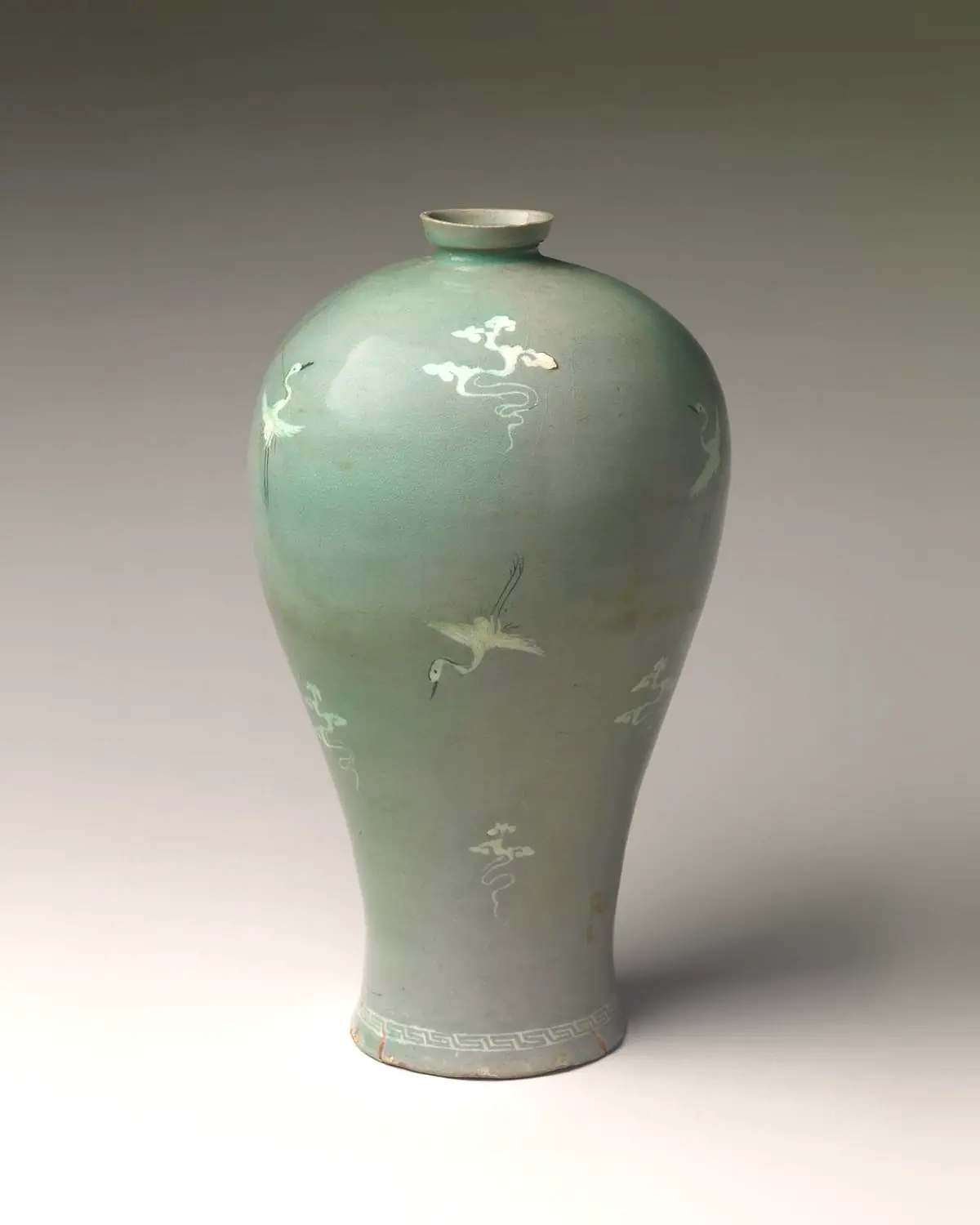 A celadon maebyeong vase inlaid with white cranes and clouds
